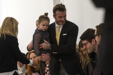 [08:34] Former England soccer captain David Beckham holds his daughter Harper before the Victoria Beckham Fall 2014 collection 