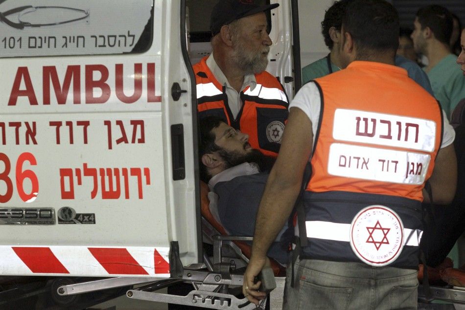 Israeli medics wheel an injured man into a hospital after an explosion in Jerusalem
