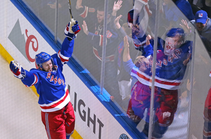 Derek Stepan celebrates