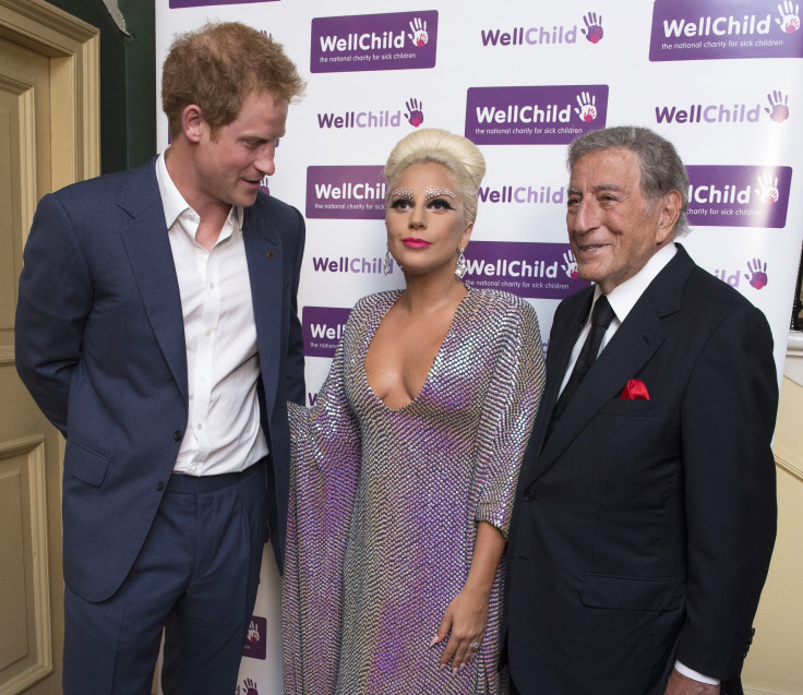 [9:16] Britain's Prince Harry (L) stands with performers Lady Gaga and Tony Bennett before a Well Child charity concert at the Royal Albert Hall