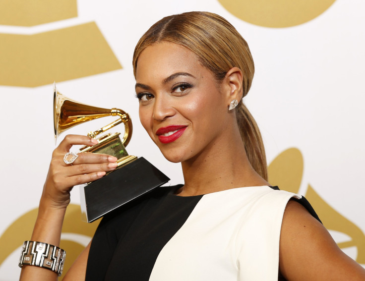 [11:45] Beyonce poses with her award for Best Traditional R&B Performance 