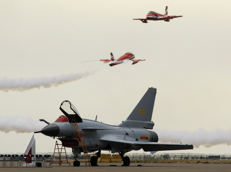 The Chengdu J-10 aircraft sitting on the tarmac at an airshow. 