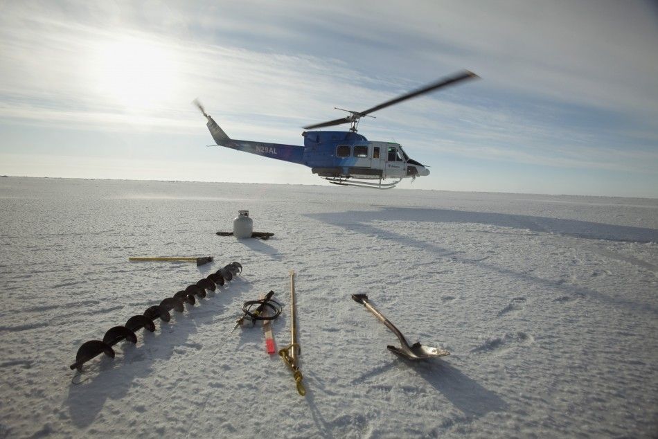 A helicopter drops off supplies at a remote warming station near the 2011 Applied Physics Laboratory Ice Station north of Prudhoe Bay 