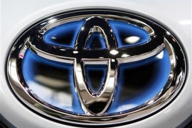 A Toyota logo is seen on the front of a plug-in Prius at the Chicago Auto Show
