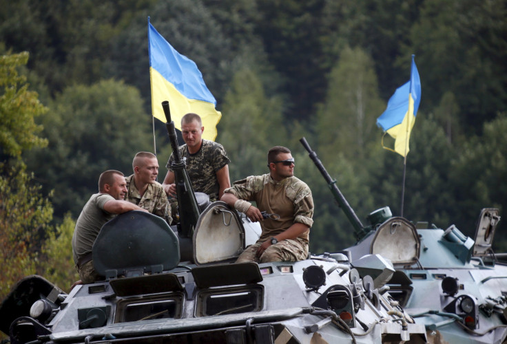 Ukrainian troops in a tank during training drills. 