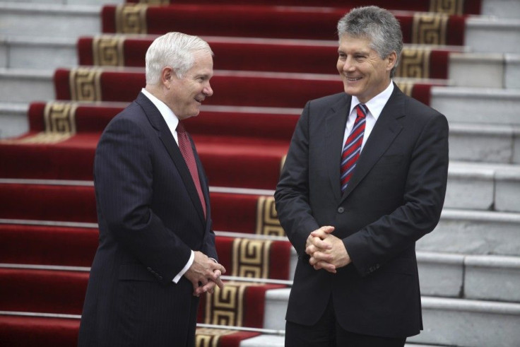 U.S. Defense Secretary Robert Gates speaks with Australia's Defence Minister Stephen Smith during the first Association of Southeast Asian Nations (ASEAN) Defence Ministers Meeting Plus at the National Convention Center in Hanoi October 12, 2010.