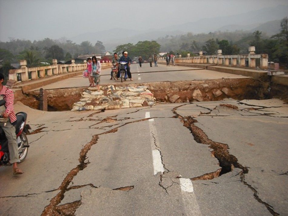 An earthquake damaged road and bridge are seen in Tarlay