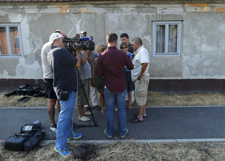 Camera crews speak with Tomislav Salopek's friends. 