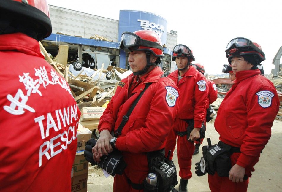 Taiwanese rescue officers prepare for their rescue operation at a village destroyed by an earthquake and tsunami in Ofunato, northeast Japan 