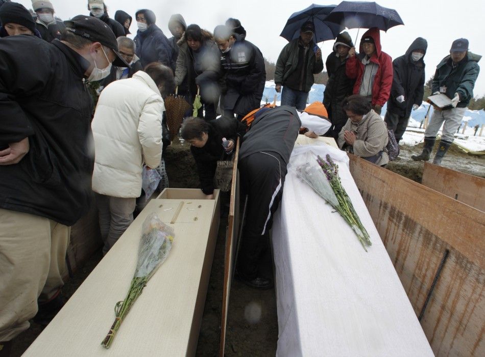 As world watches Fukushima nuclear plant, Japan mourns deaths in silence