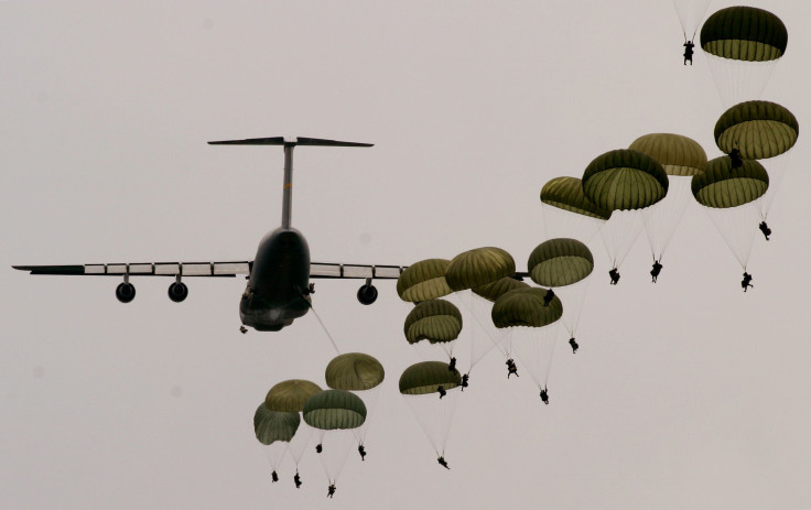 Army Rangers jump from a C-5 transport plane