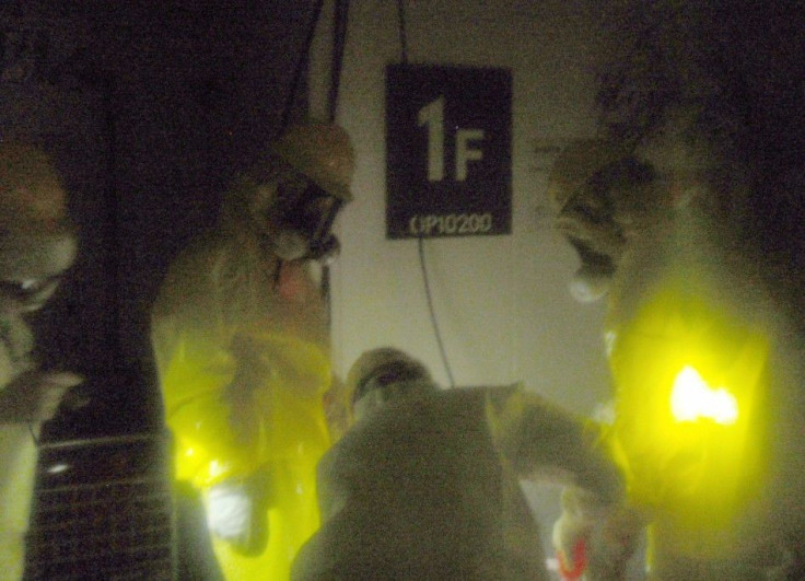 Handout photo from Japan's Nuclear and Industrial Safety Agency shows Tokyo Electric Power Co. workers refuelling portable power generator at Fukushima Daiichi Nuclear Power Plant in Tomioka