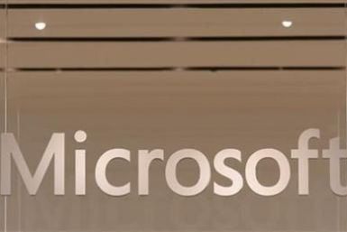 The Microsoft logo hangs from a window during the grand opening of Microsoft's first retail store in Scottsdale