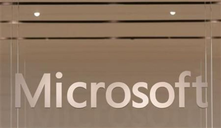 The Microsoft logo hangs from a window during the grand opening of Microsoft's first retail store in Scottsdale