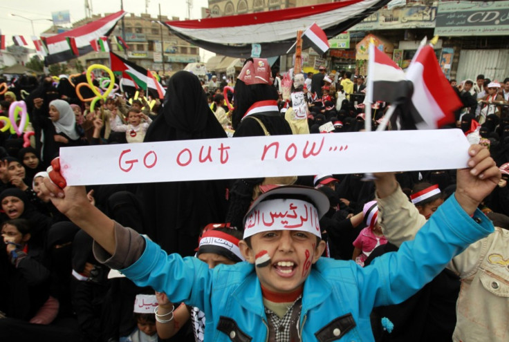 A girl shouts slogans during a sit-in to demand for the ouster of Yemen's President Ali Abdullah Saleh, outside Sanaa University