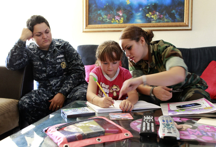 U.S. military same-sex couple with their child. 