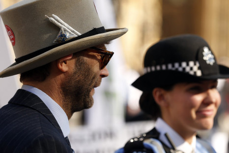 A campaigner and police officer stand side by side 