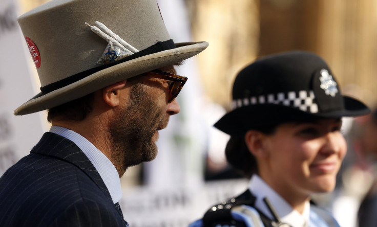 A campaigner and police officer stand side by side 
