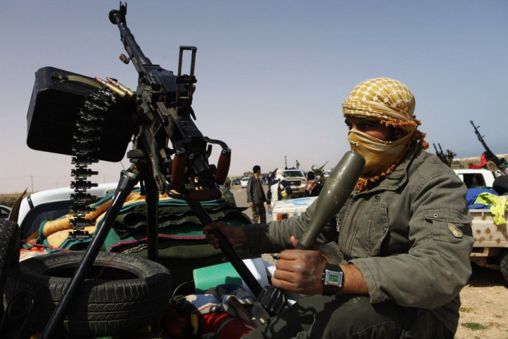 Rebel fighter rides west in pursuit of forces loyal to Muammar Gaddafi some 120 km (75 miles) east of Sirte in eastern Libya, March 28, 2011.