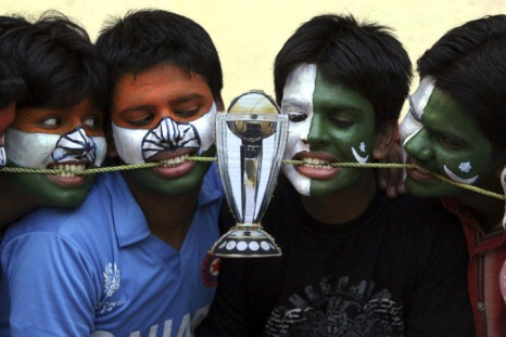 Cricket fans with their faces painted with the Indian and Pakistani national flags
