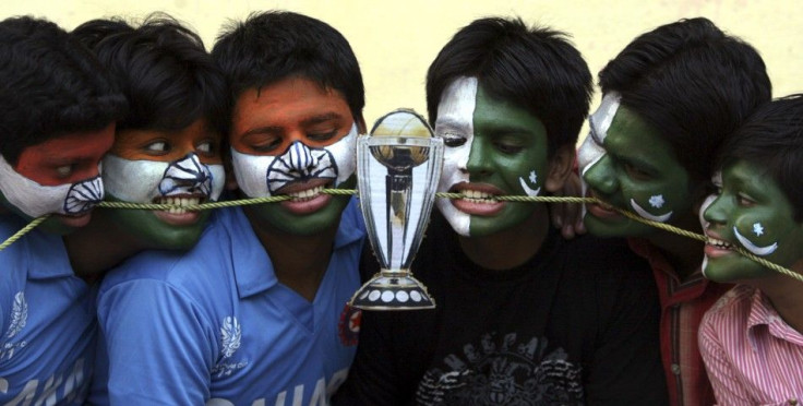 Cricket fans with their faces painted with the Indian and Pakistani national flags