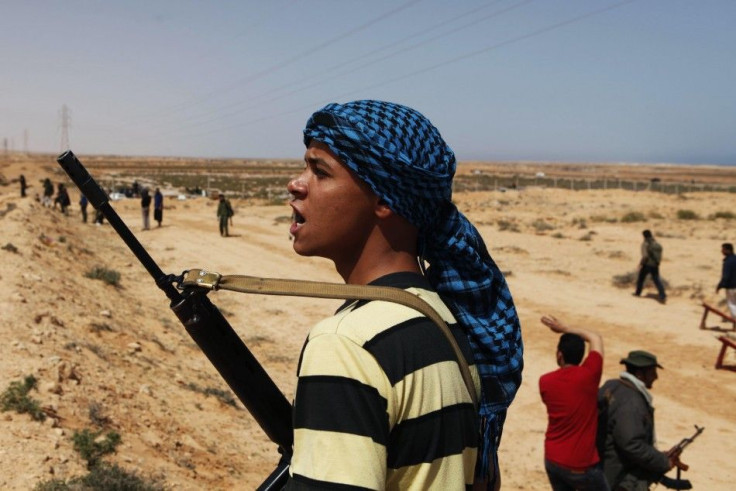 Rebel fighter moves across the desert in eastern Libya
