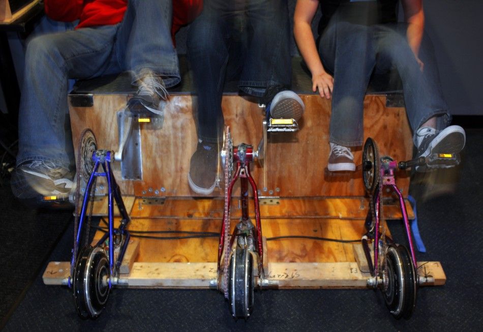 Members of the audience pedal the quotSustainable Soundquot system, an eco friendly power generator, during a band performance in Somerville