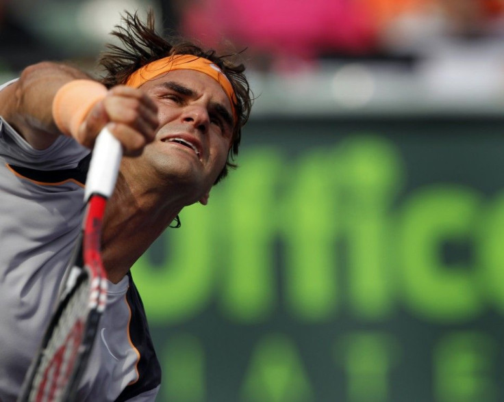 Roger Federer of Switzerland serves during his match against Juan Monaco of Argentina at the Sony Ericsson Open tennis tournament in Key Biscayne.