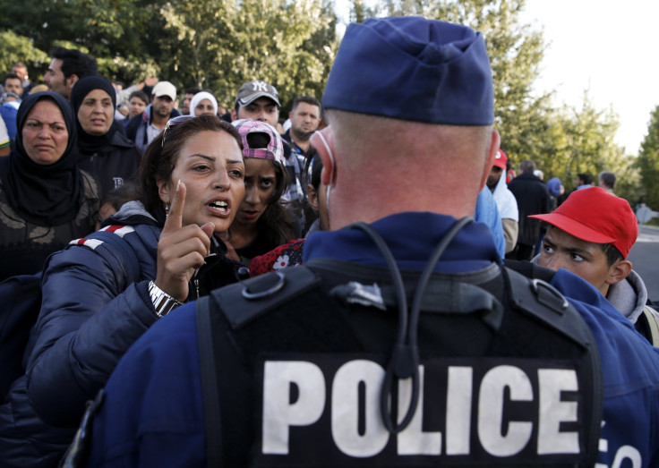 Hungarian police officer, refugees