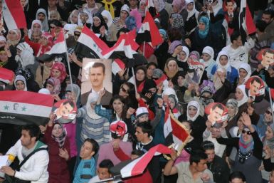 Supporters of Syria's President Bashar al-Assad shout slogans in Syria's northern city of Aleppo