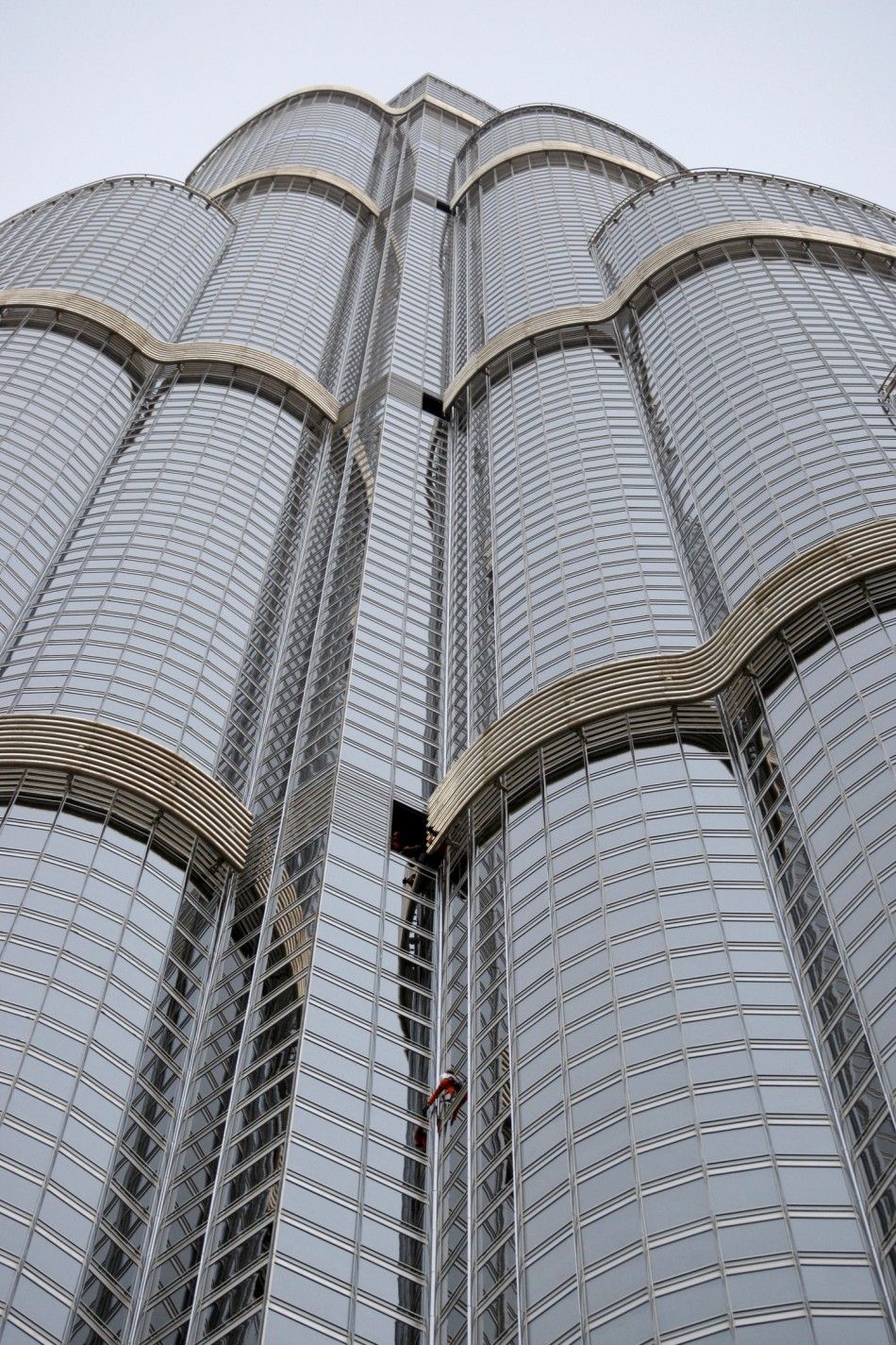 French climber Alain Robert scales the worlds tallest tower, the Burj Khalifa, in Dubai