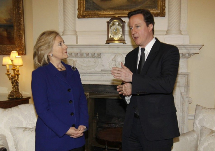 Britain's Prime Minister Cameron speaks to U.S. Secretary of State Clinton inside 10 Downing Street in London