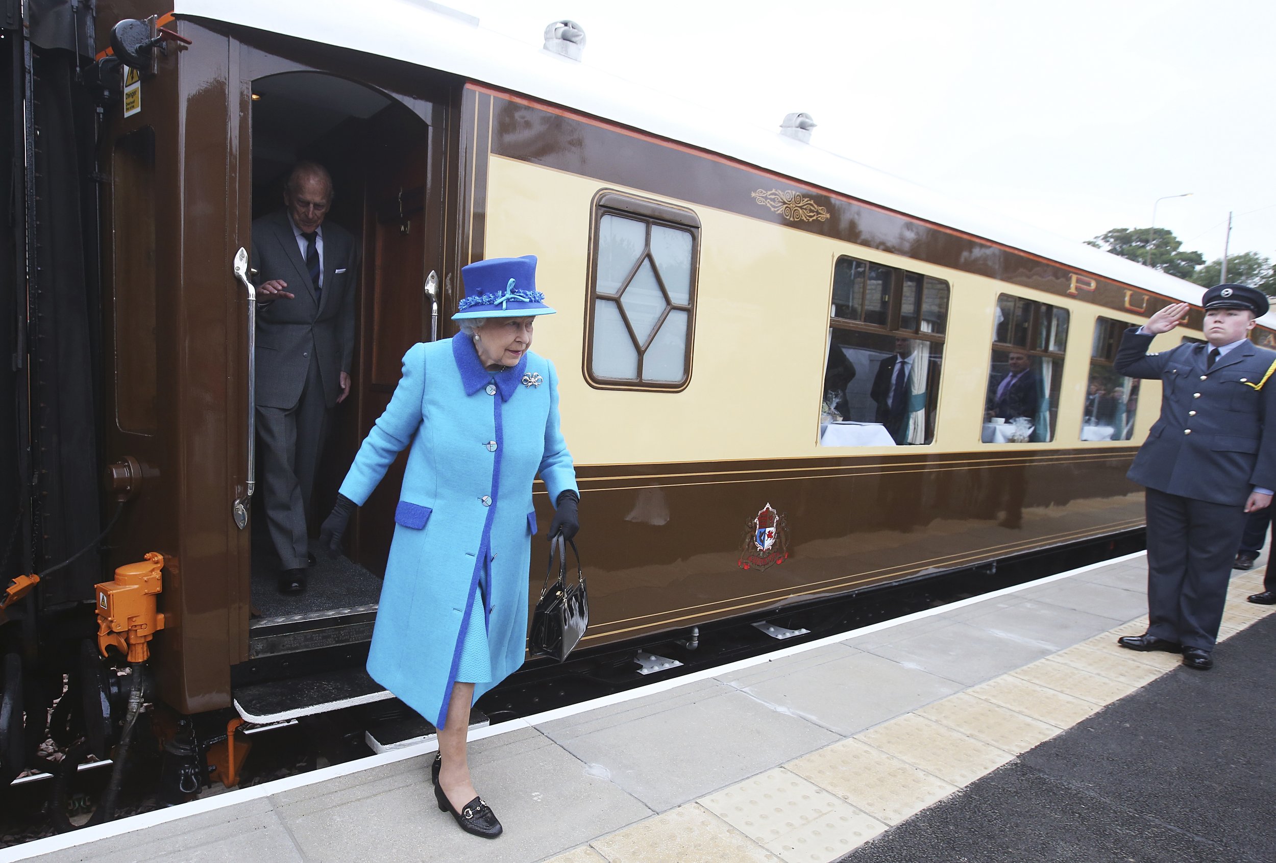 1233 Britains Queen Elizabeth steps off the royal train at Newtongrange railway station