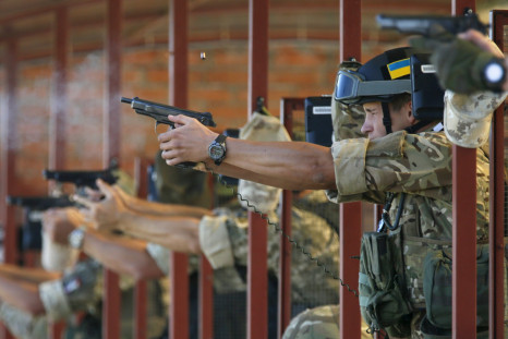 Soldiers from Ukraine's National Guard fire at a training session. 