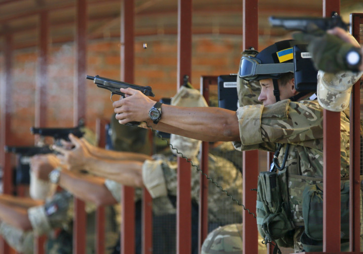 Soldiers from Ukraine's National Guard fire at a training session. 