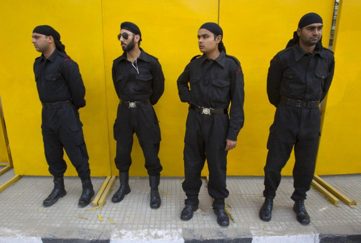 Police commandos stand guard outside the Punjab Cricket Association stadium ahead of India's ICC Cricket World Cup semi-final match against Pakistan in Mohali.