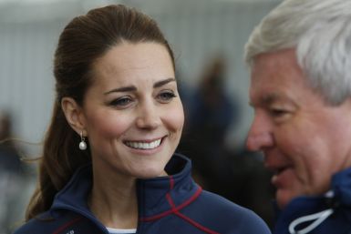 [08:46] Britain's Catherine, Duchess of Cambridge, smiles as she tours the base of Emirates Team New Zealand