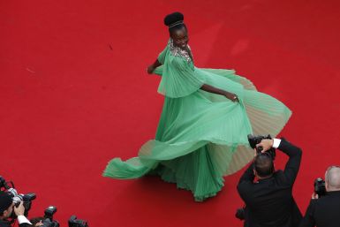 [13:52] Actress Lupita Nyong'o poses on the red carpet 