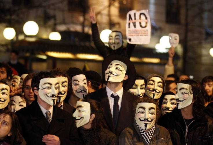 Protestors wearing Fawkes masks 