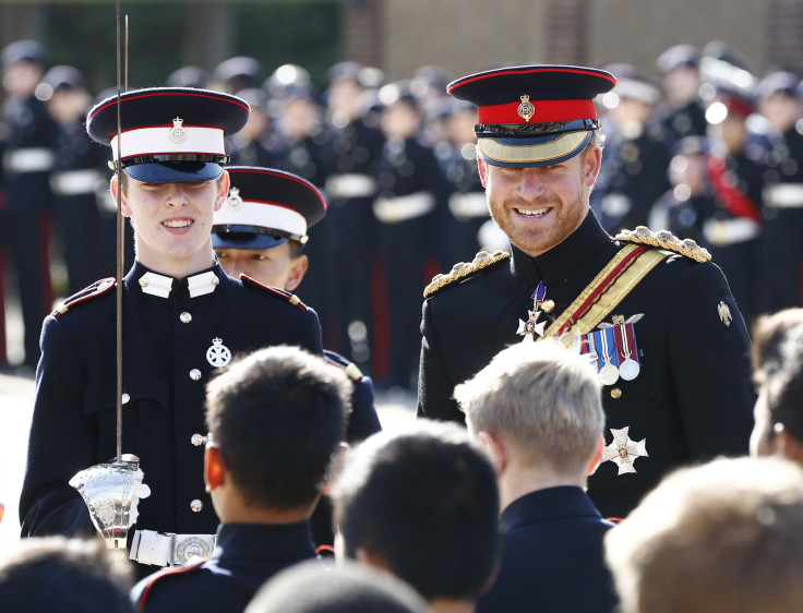 [12:26] Britain's Prince Harry inspects the student guards during his visit to The Duke of York's Royal Military School