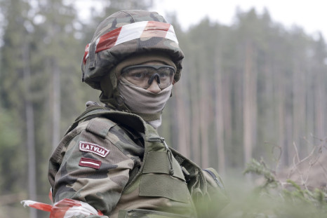 A Latvian soldier stands during a training exercise.