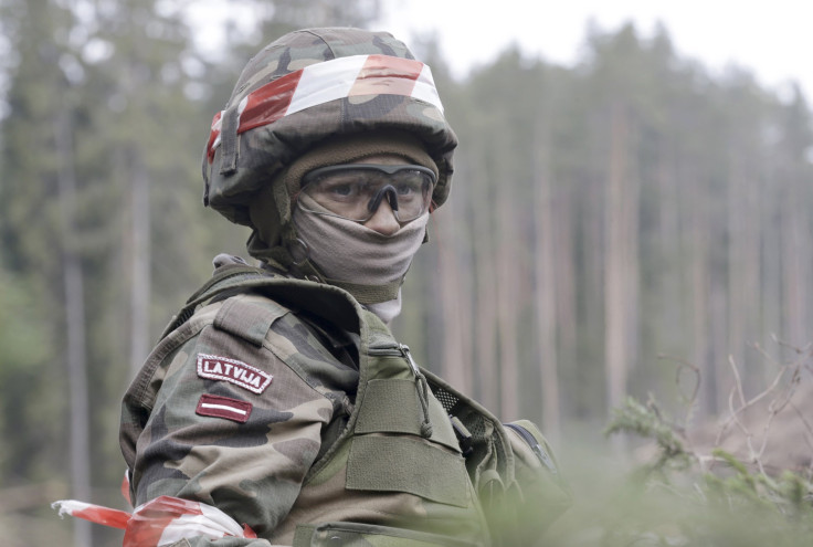 A Latvian soldier stands during a training exercise.