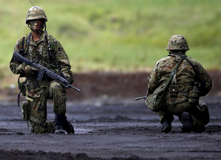 Japanese soldiers kneel during a training exercise