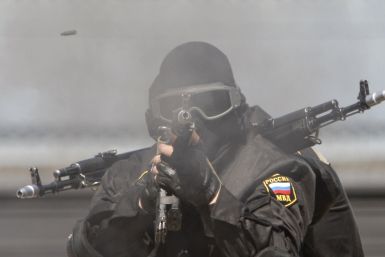 A Russian Special Forces soldier fires a rifle during a demonstration 