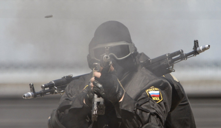 A Russian Special Forces soldier fires a rifle during a demonstration 