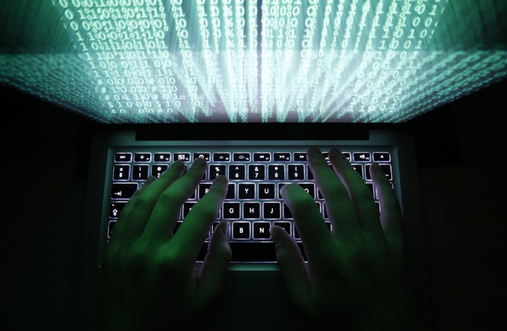 A man types on a keyboard. 