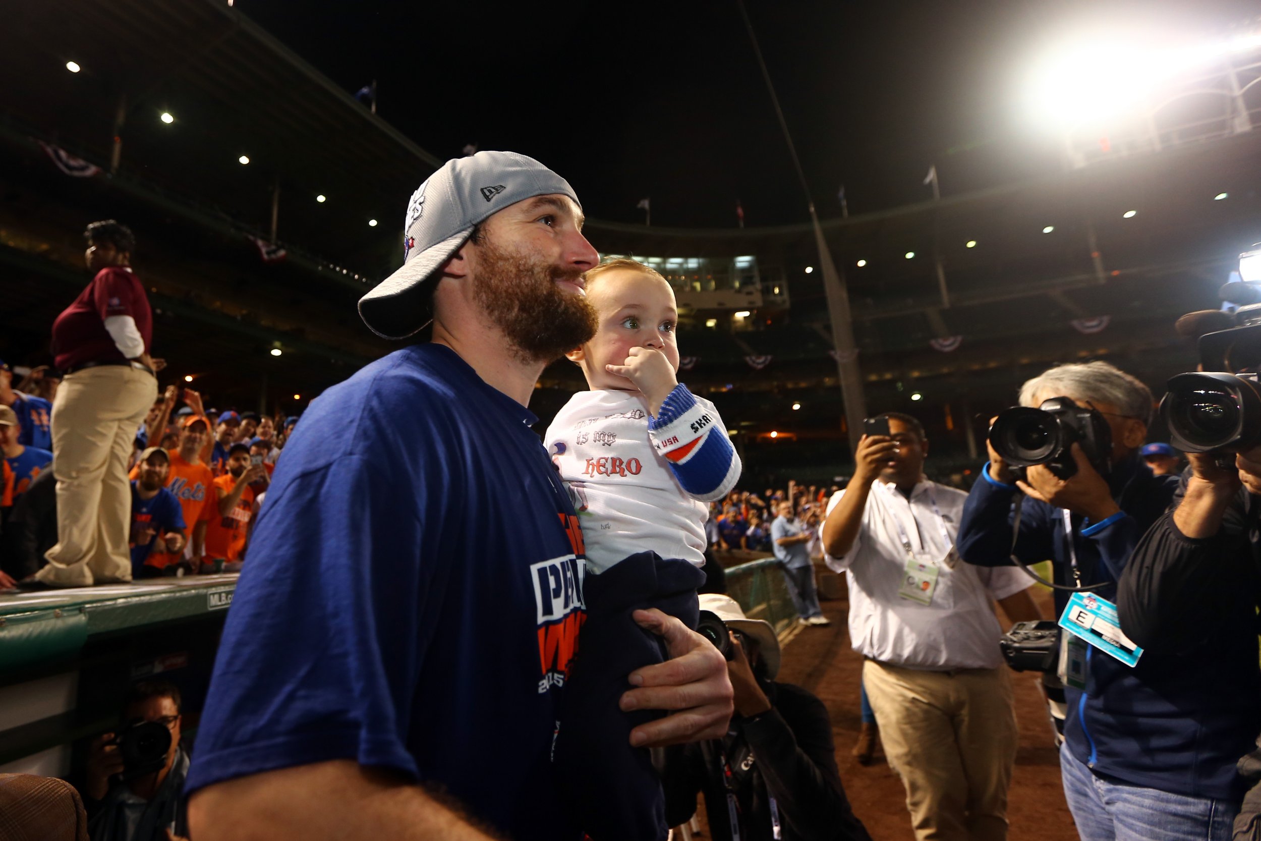 New York Mets' Daniel Murphy celebrates the Mets 8-3 victory over the  Chicago Cubs with his wife Victoria Ahern and their son Noah after game 4  of the National League Championship Series