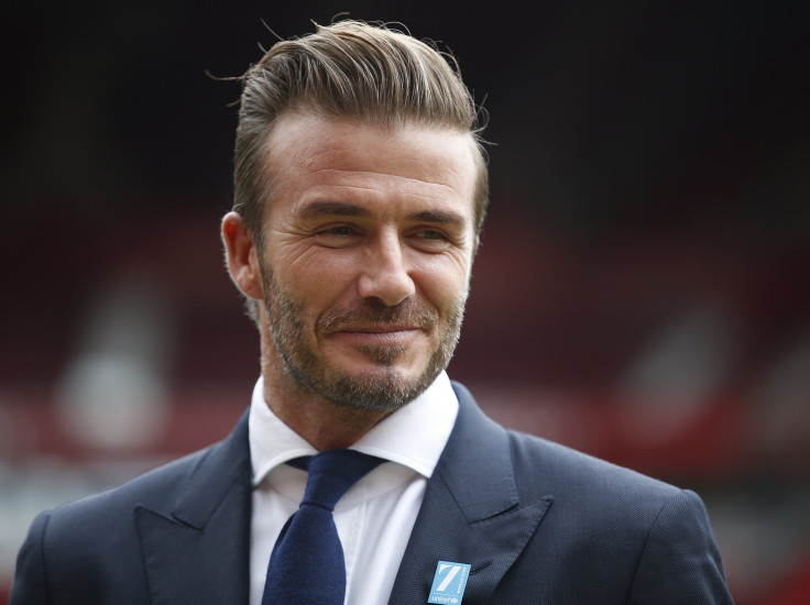 [08:51] David Beckham poses for photographers at Old Trafford