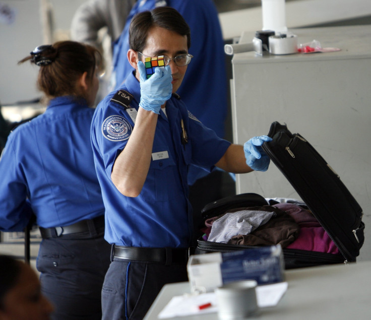 TSA staff check bags at Los Angeles International Airport