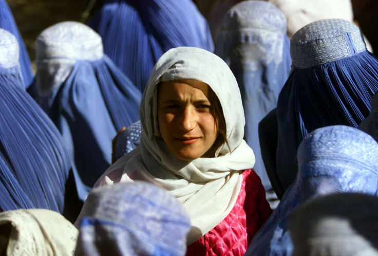 An Afghan woman reveals her face for the first time